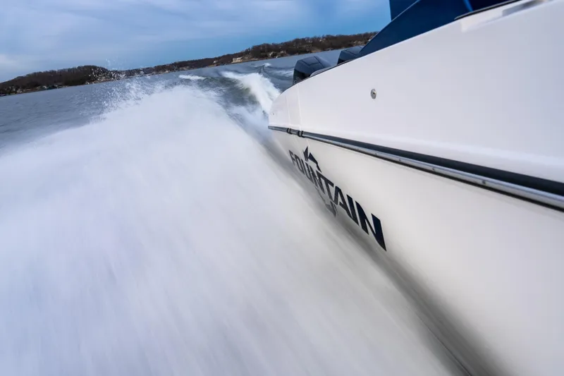 Slide: The Image of 2026 Fountain 38 SCX speedboat slicing through water at high speed. - 34