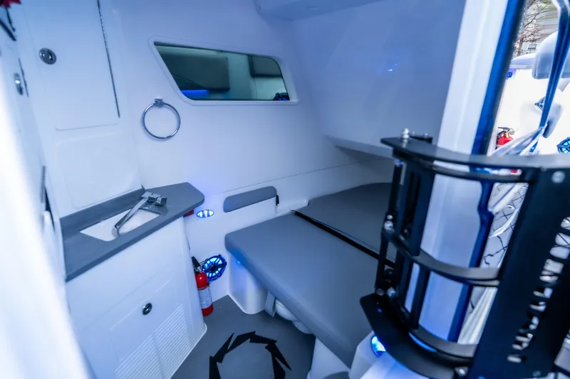 Slide: The Image of Interior cabin of 2026 Fountain 38 SCX boat with modern amenities and seating. - 36
