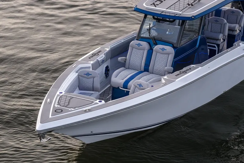 Slide: The Image of 2026 Fountain 38 SCX boat with sleek design and luxurious seating on calm water. - 6
