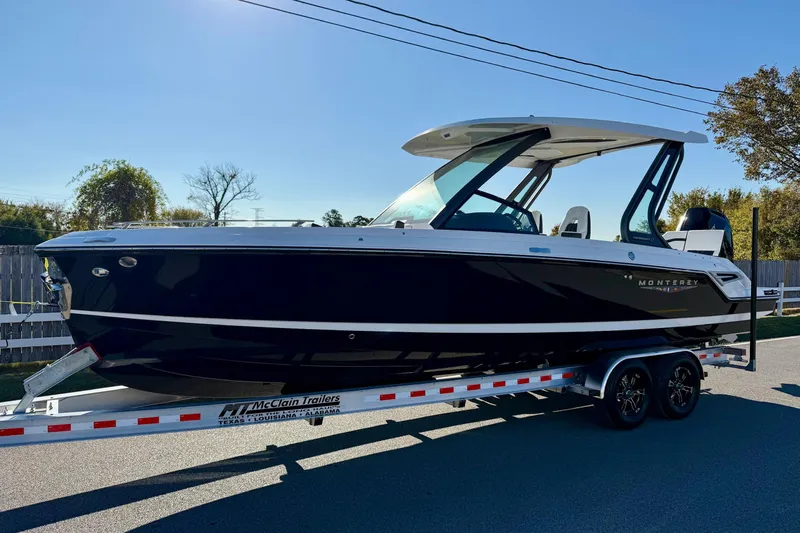 The Image of 2026 Monterey Elite 27 OB boat on trailer in daylight. - 1