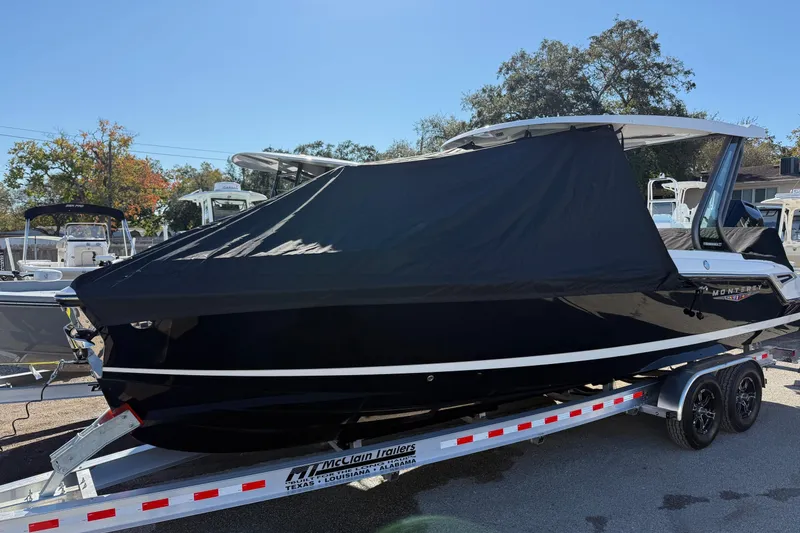 Slide: The Image of 2026 Monterey Elite 27 OB boat with cover on trailer. - 25