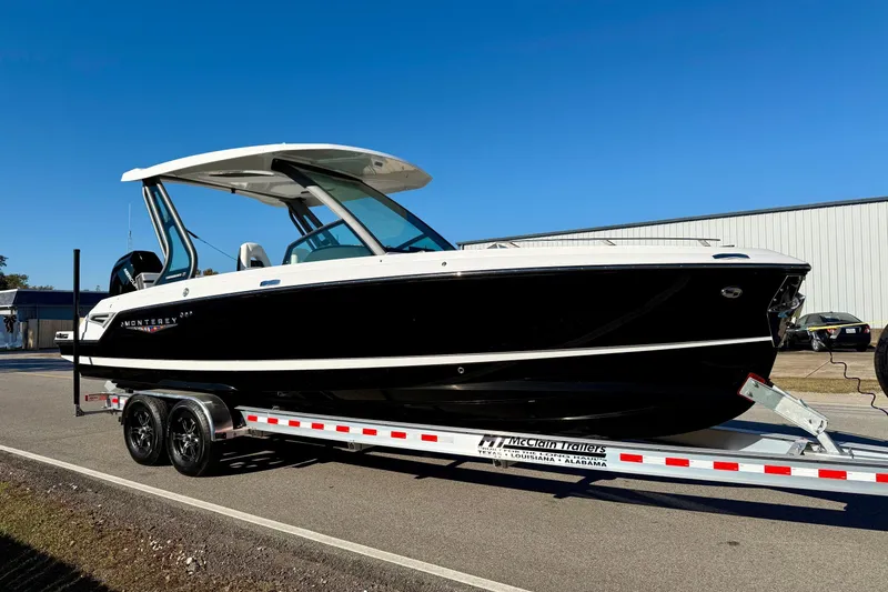 Slide: The Image of 2026 Monterey Elite 27 OB boat on trailer, side view. - 5
