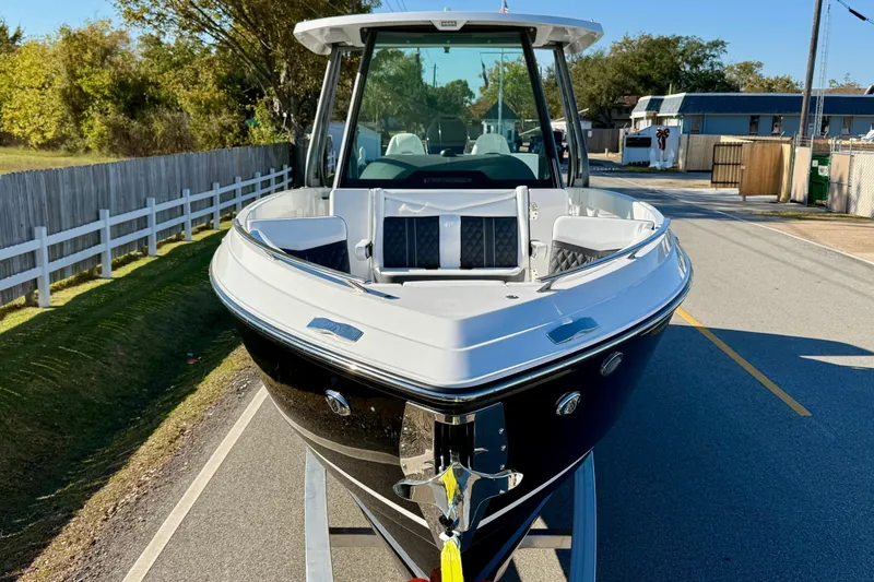 Slide: The Image of 2026 Monterey Elite 27 OB boat on trailer, front view. - 6