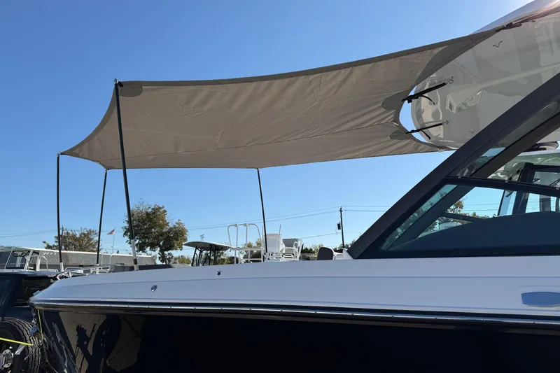 Slide: The Image of 2026 Monterey Elite 27 OB with sunshade outdoors. - 21