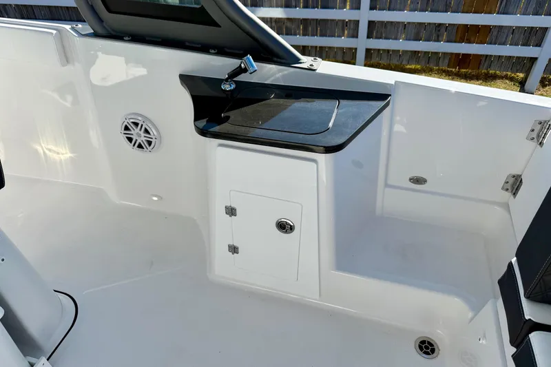Slide: The Image of Interior of 2026 Monterey Elite 27 OB with storage and speaker. - 10