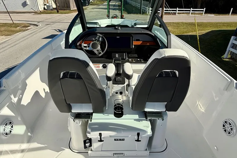 Slide: The Image of Interior of 2026 Monterey Elite 27 OB with modern helm console. - 11