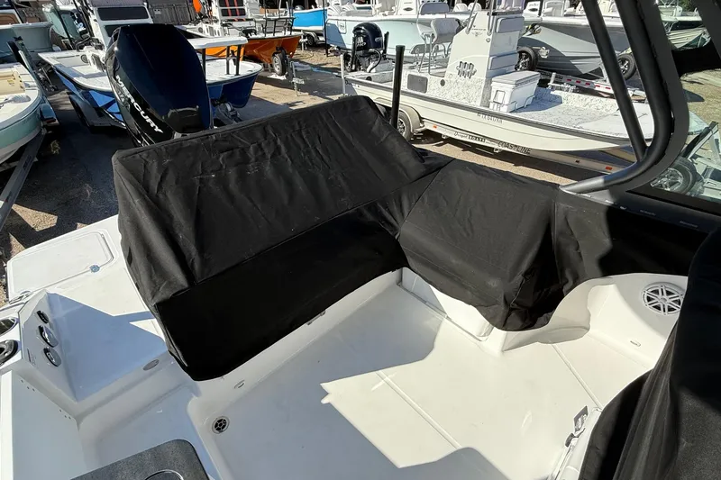 Slide: The Image of Interior of a 2026 Monterey Elite 27 OB boat with covers. - 22