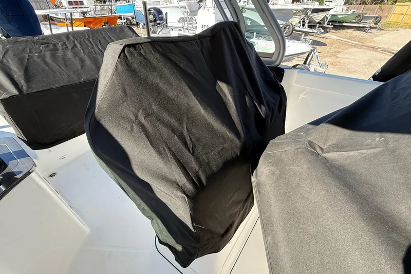 Slide: The Image of Covered seats on a 2026 Monterey Elite 27 OB boat. - 23