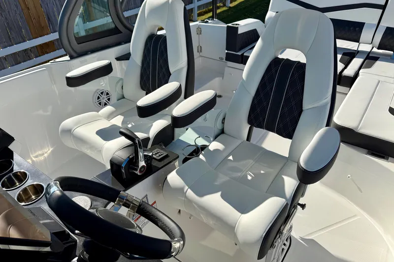 Slide: The Image of Interior of 2026 Monterey Elite 27 OB with luxurious seating. - 13
