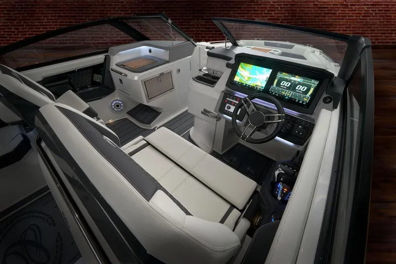 Slide: The Image of Manufacturer Provided Image: 2026 Cobalt R31 OB boat interior with modern dashboard and dual displays. - 7