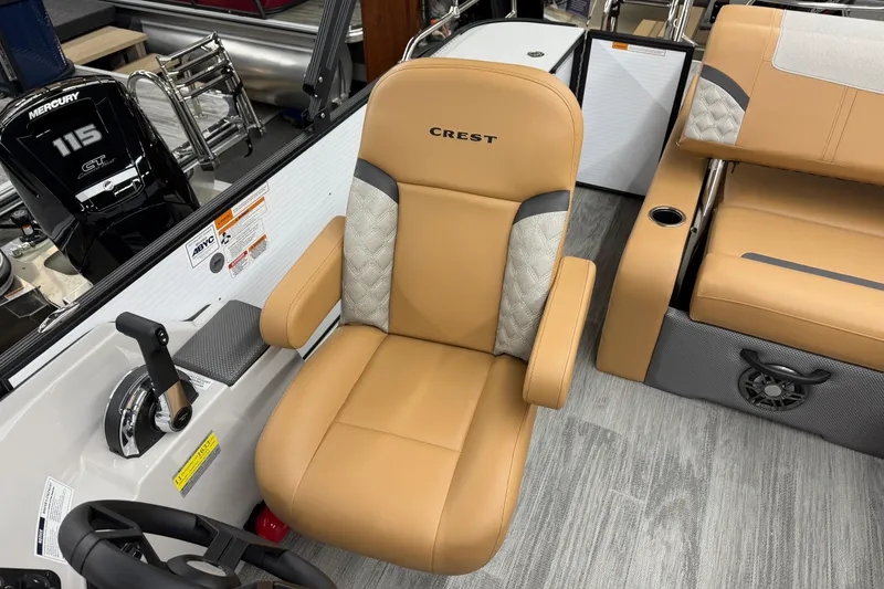 Slide: The Image of 2025 Crest Classic 220 boat interior with tan seating and Mercury 115 engine. - 6