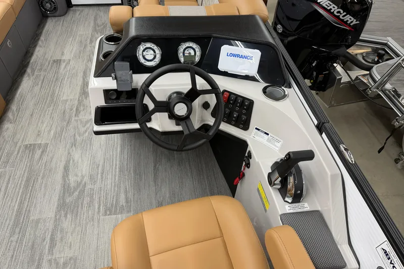 Slide: The Image of 2025 Crest Classic 220 boat dashboard with steering wheel and control panel. - 7