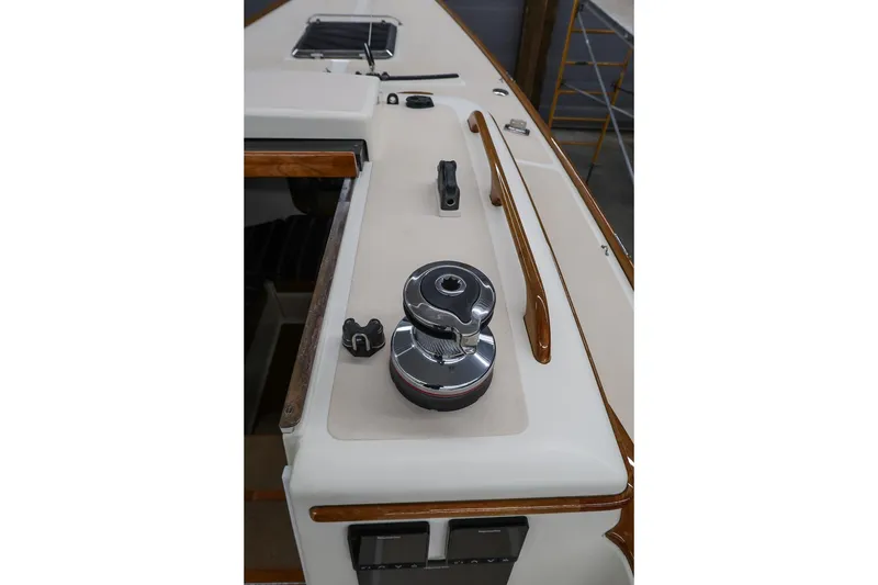 Slide: The Image of 2011 Morris M29 sailboat deck with winch and wooden trim details. - 10