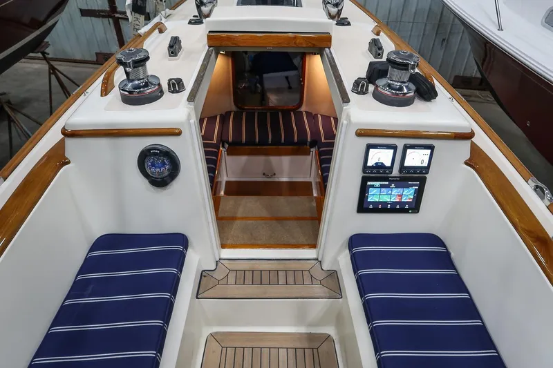 Slide: The Image of Interior of a 2011 Morris M29 sailboat with striped seating and navigation instruments. - 15