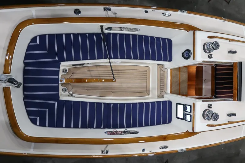Slide: The Image of Top view of 2011 Morris M29 sailboat interior with striped cushions and wooden accents. - 16
