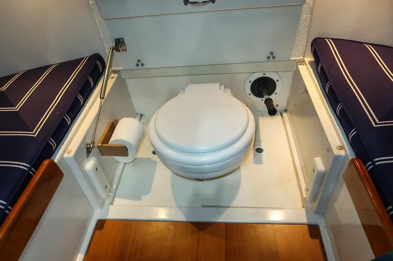 Slide: The Image of Compact marine toilet in 2011 Morris M29 boat interior with striped cushions. - 20