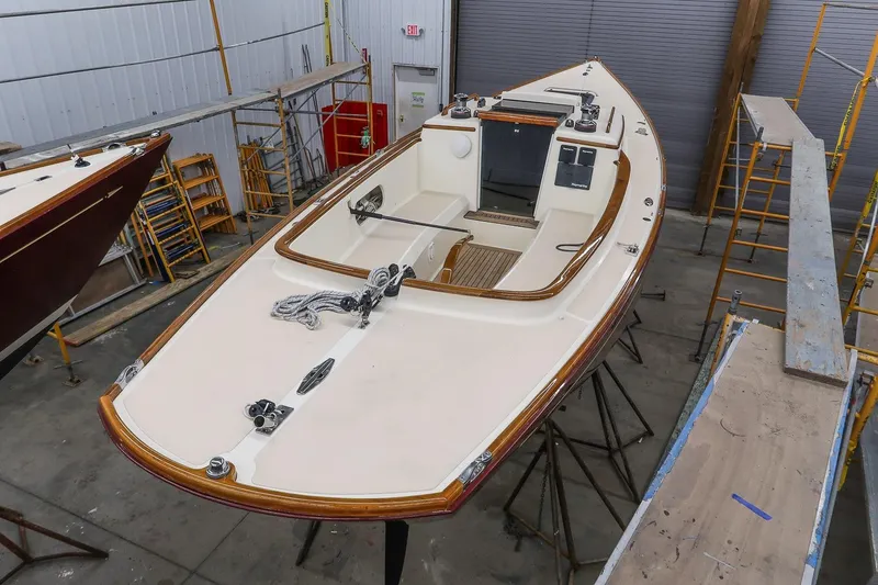 Slide: The Image of 2011 Morris M29 sailboat in a workshop, showcasing deck and interior details. - 6