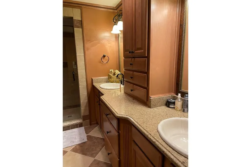 Slide: The Image of Luxurious kitchen in 2007 Summerset houseboat, featuring wooden cabinetry and stainless steel appliances. - 10