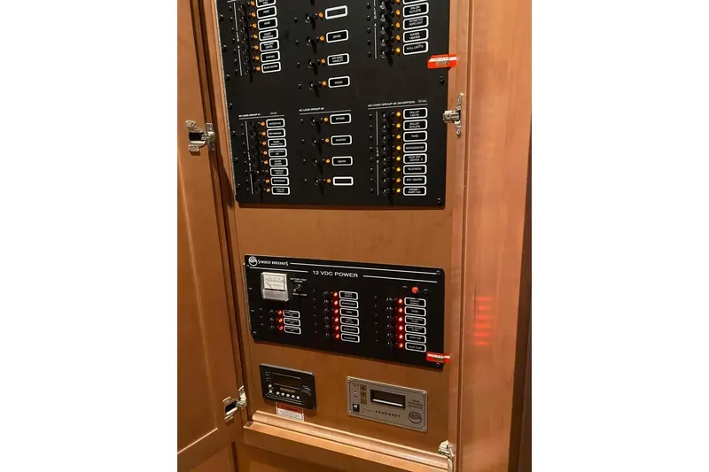 Slide: The Image of Kitchen interior of 2007 Summerset 21' x 106' houseboat with wooden cabinets and modern appliances. - 102