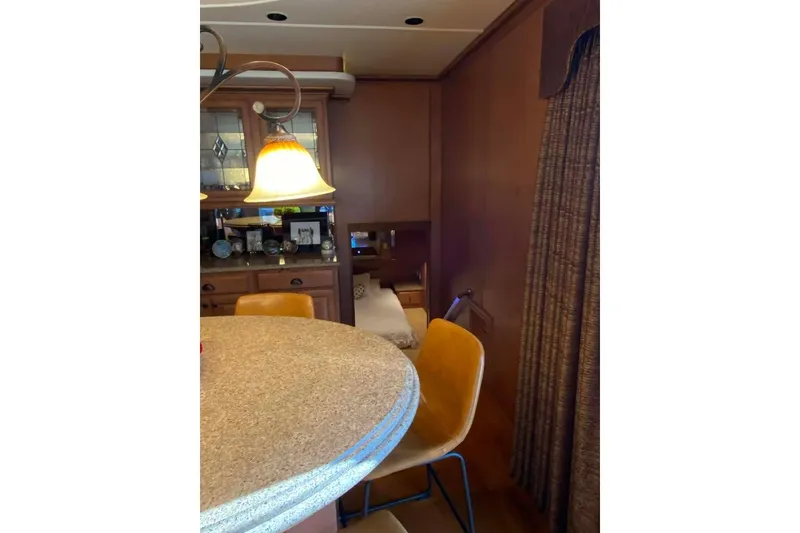 Slide: The Image of Cozy bedroom with wooden decor in 2007 Summerset 21' x 106' model houseboat. - 111