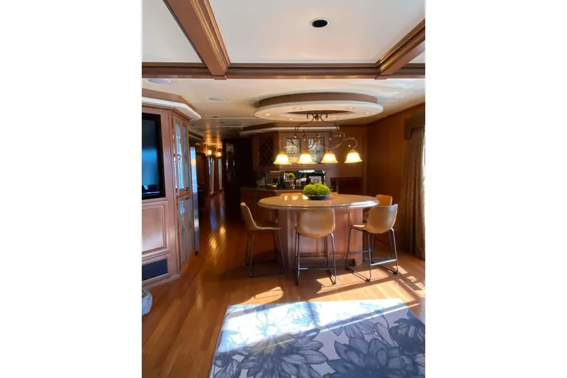 Slide: The Image of Luxurious kitchen interior of 2007 Summerset 21' x 106' houseboat with wood cabinetry. - 112