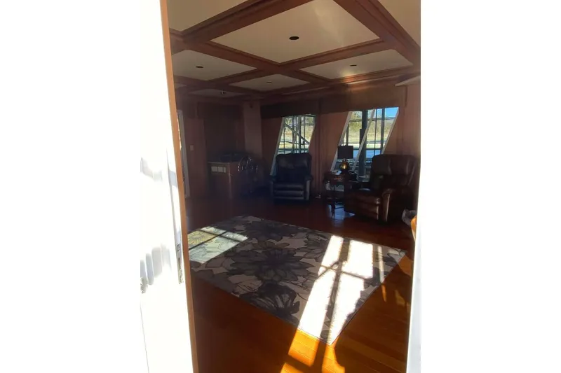 Slide: The Image of Interior of 2007 Summerset houseboat, featuring wooden cabinetry and modern kitchen amenities. - 113