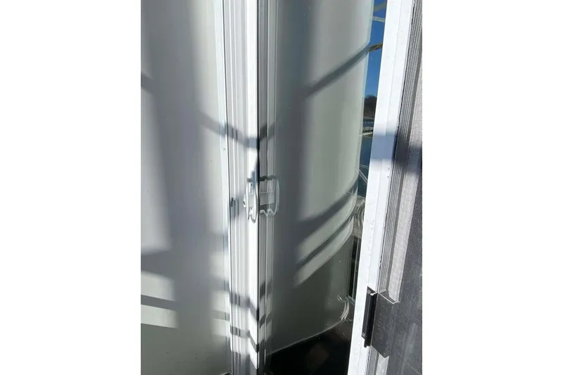 Slide: The Image of Interior of 2007 Summerset houseboat with dining area and warm lighting. - 114