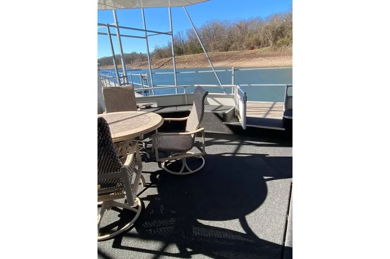 Slide: The Image of Luxurious interior of 2007 Summerset houseboat with elegant dining area and modern decor. - 115