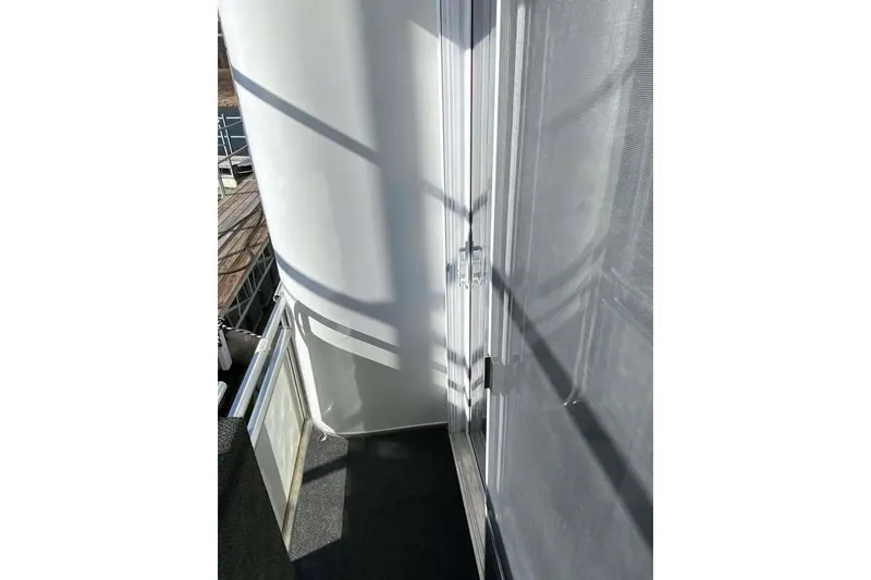 Slide: The Image of Luxurious interior of 2007 Summerset houseboat, featuring elegant wood paneling and comfortable seating. - 116