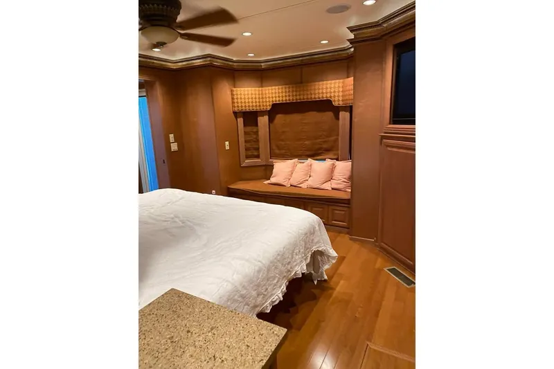 Slide: The Image of Luxurious bedroom and bathroom interior in 2007 Summerset model, featuring elegant wood finishes. - 12