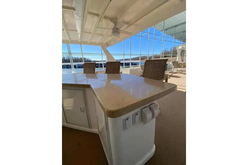 Slide: The Image of Bow view of 2007 Summerset 21' x 106' houseboat on calm water. - 124