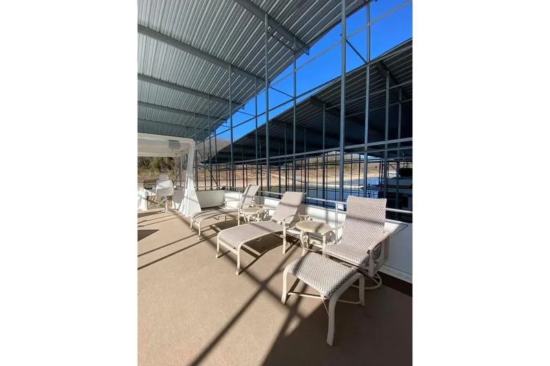 Slide: The Image of Helm of 2007 Summerset 21' x 106' houseboat with steering wheel and controls. - 126