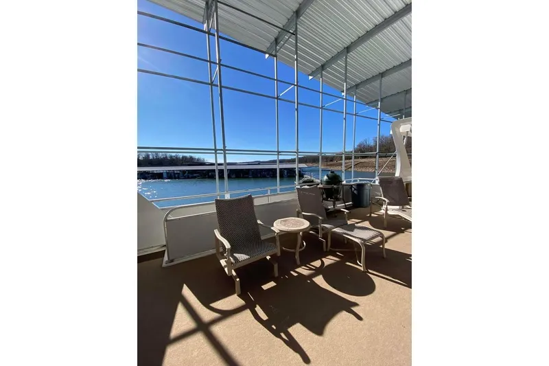 Slide: The Image of Covered deck with lounge chairs on a 2007 Summerset 21' x 106' houseboat. - 129