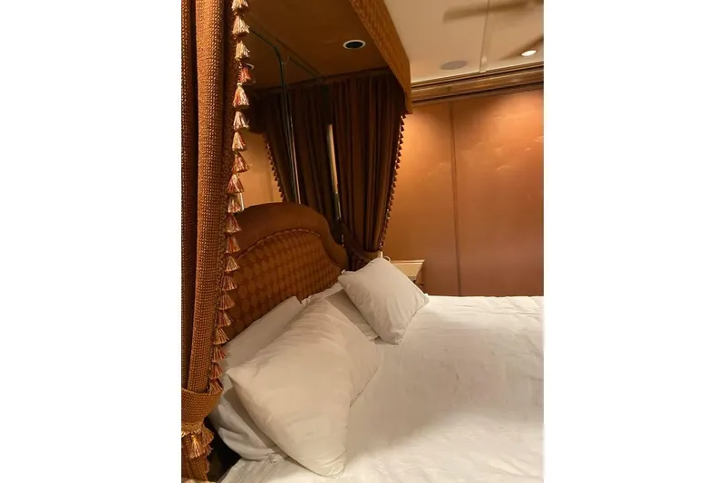 Slide: The Image of Luxurious bathroom with wooden cabinetry, granite countertops, and a walk-in shower in a 2007 Summerset model. - 13