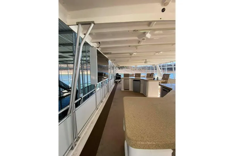 Slide: The Image of Luxurious 2007 Summerset houseboat interior with spacious seating and scenic water views. - 134