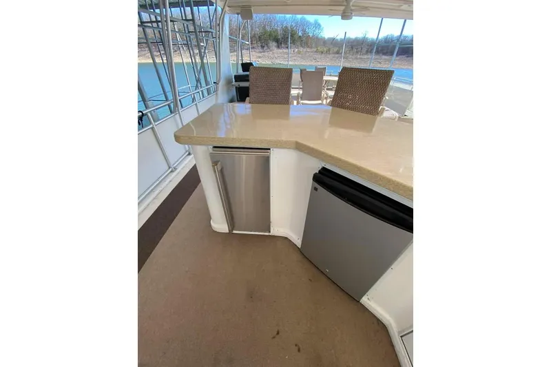 Slide: The Image of Spacious upper deck of 2007 Summerset 21' x 106' houseboat with seating and helm. - 136