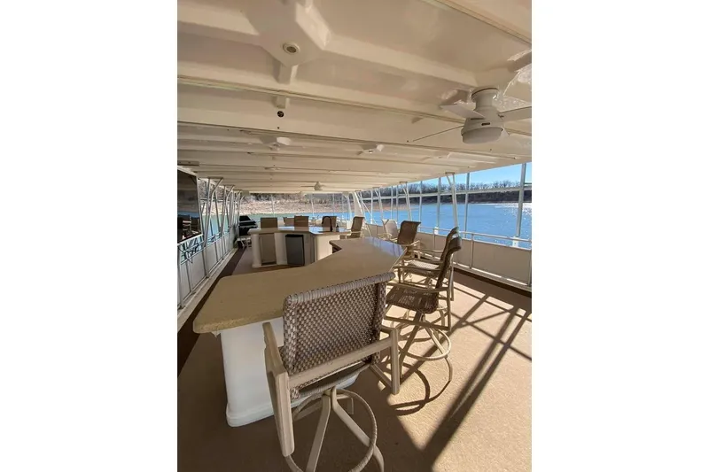 Slide: The Image of Luxurious 2007 Summerset houseboat interior with bar and seating area. - 139