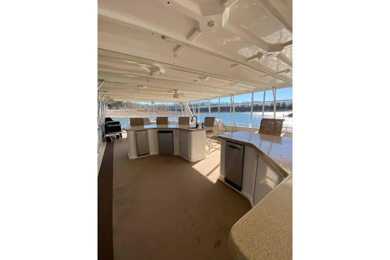 Slide: The Image of Luxurious 2007 Summerset houseboat interior with spacious deck and seating area. - 140