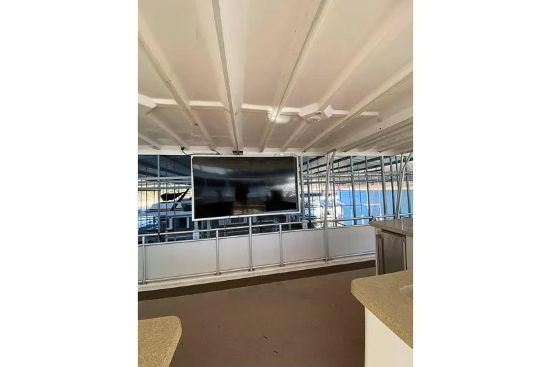 Slide: The Image of Luxurious 2007 Summerset houseboat interior with modern kitchen and scenic lake view. - 141