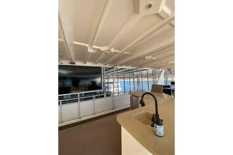 Slide: The Image of Spacious deck of 2007 Summerset houseboat with bar seating and river view. - 142