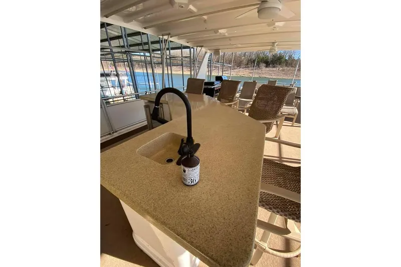 Slide: The Image of Spacious 2007 Summerset houseboat interior with modern kitchen and scenic lake view. - 143