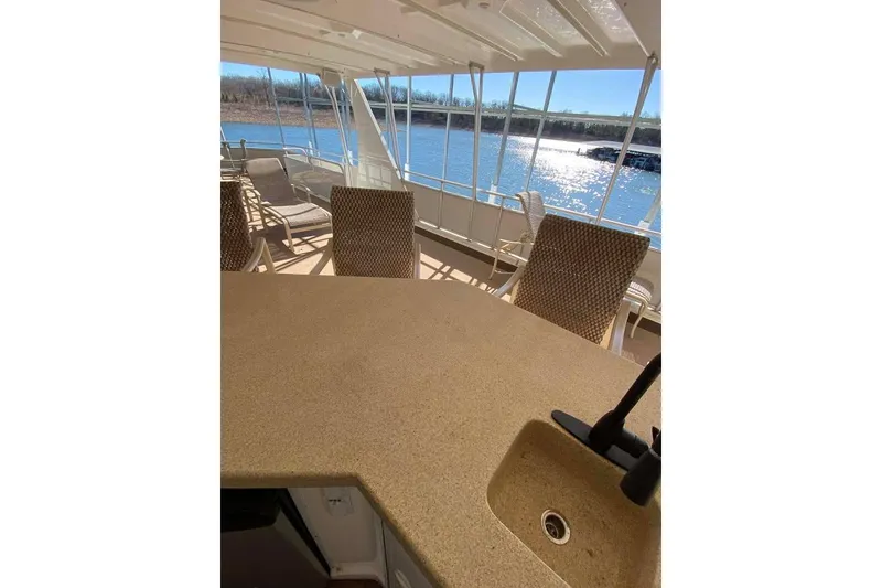 Slide: The Image of Outdoor kitchen area on 2007 Summerset houseboat with sink and seating. - 146