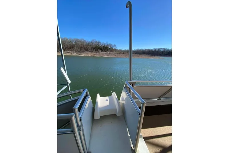 Slide: The Image of Luxurious Summerset 21' x 106' 2007 houseboat interior with bar stools and mounted TV. - 152