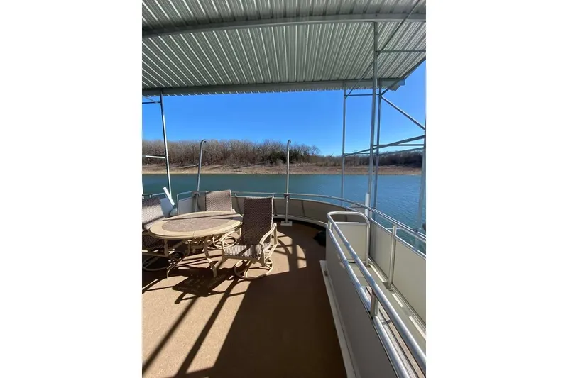 Slide: The Image of Outdoor seating on Summerset houseboat, 21' x 106', 2007 model, overlooking serene water. - 158