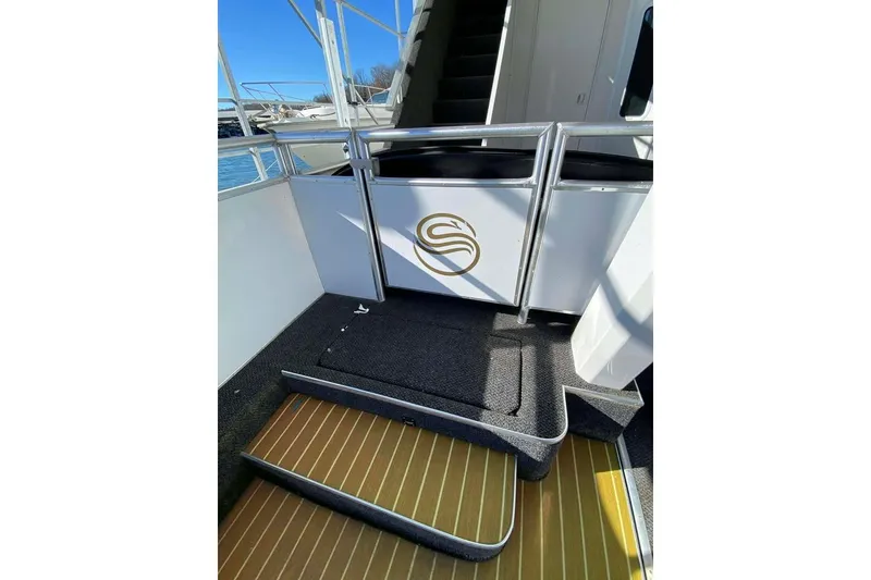 Slide: The Image of Covered deck on 2007 Summerset houseboat overlooking serene lake view. - 162