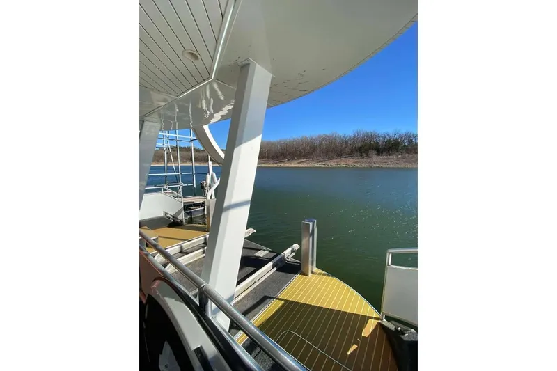 Slide: The Image of Boat deck with metal railings, Summerset 21' x 106', 2007 model, near water. - 171
