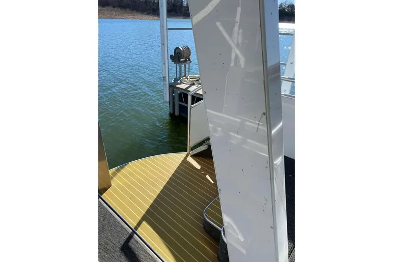 Slide: The Image of Houseboat deck with yellow flooring on water, Summerset 21' x 106', 2007 model. - 173