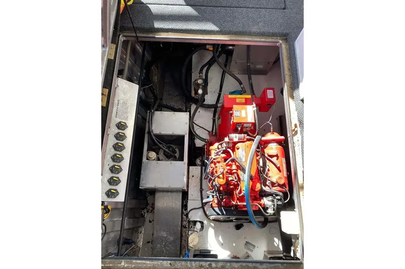 Slide: The Image of Engine compartment of 2007 Summerset 21' x 106' houseboat, showcasing mechanical components. - 182