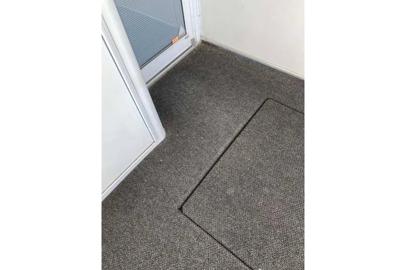 Slide: The Image of Electrical compartment of a 2007 Summerset 21' x 106' boat, featuring wiring and components. - 184