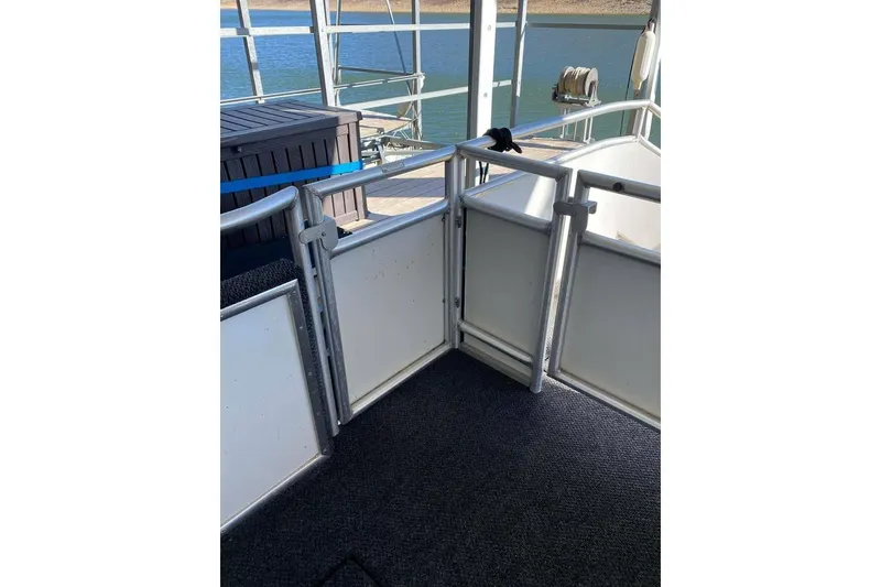 Slide: The Image of Engine compartment of 2007 Summerset 21' x 106' houseboat, showcasing mechanical components. - 185